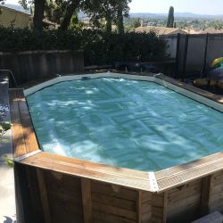 Bâche à bulles luxe SolGuard pour piscine bois Sunbay Gre octogonale allongée
